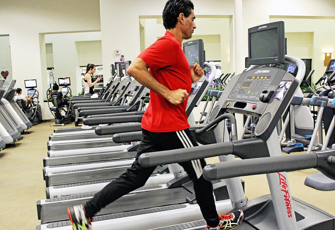 Man running on an indoor treadmill