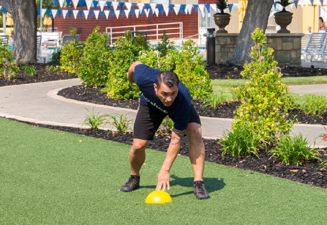 A male trainer doing football drills