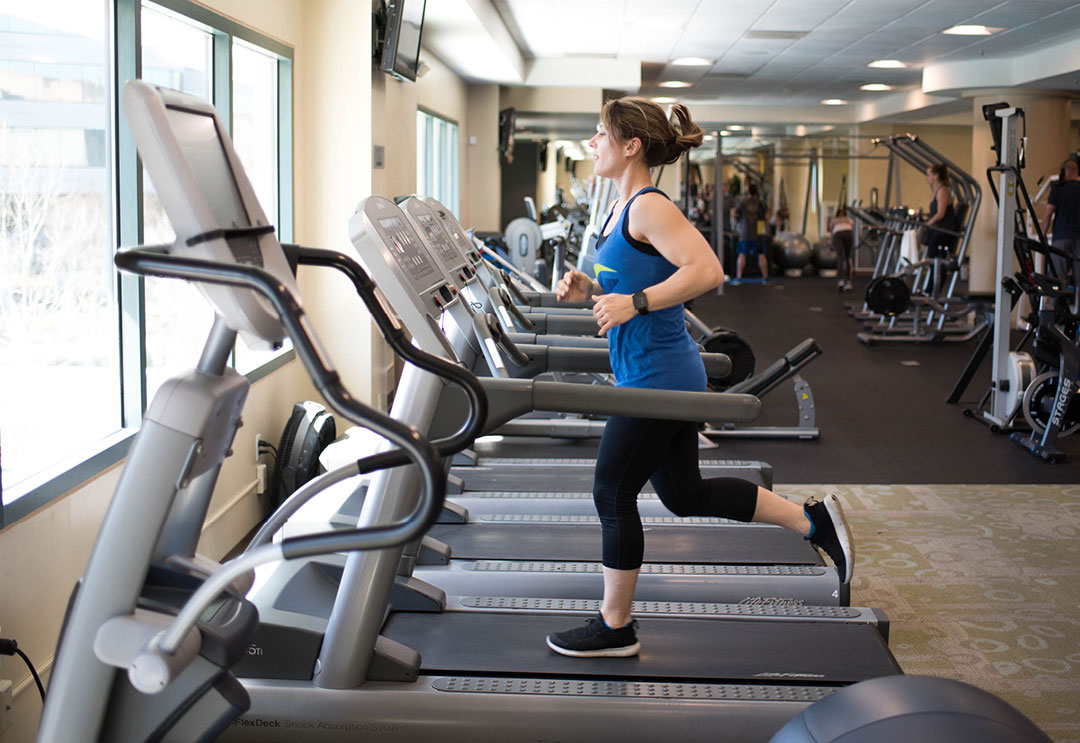 Woman running on a treadmill doing a workout