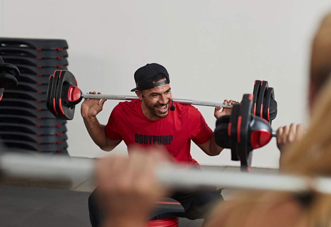 An instructor teaching BODYPUMP Les Mills classes at ClubSport