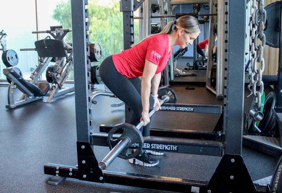 A personal trainer doing the Ultimate Leg Strength Workout of the Month