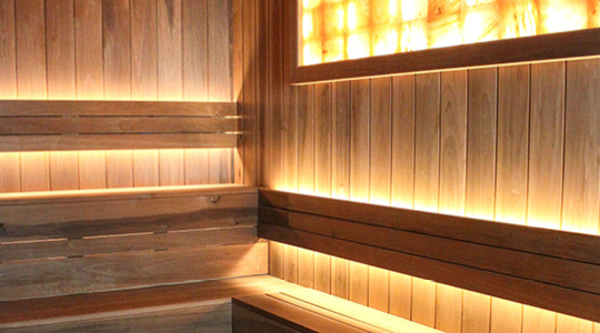 View of the newly remodeled dry sauna with pink Himalayan salt wall