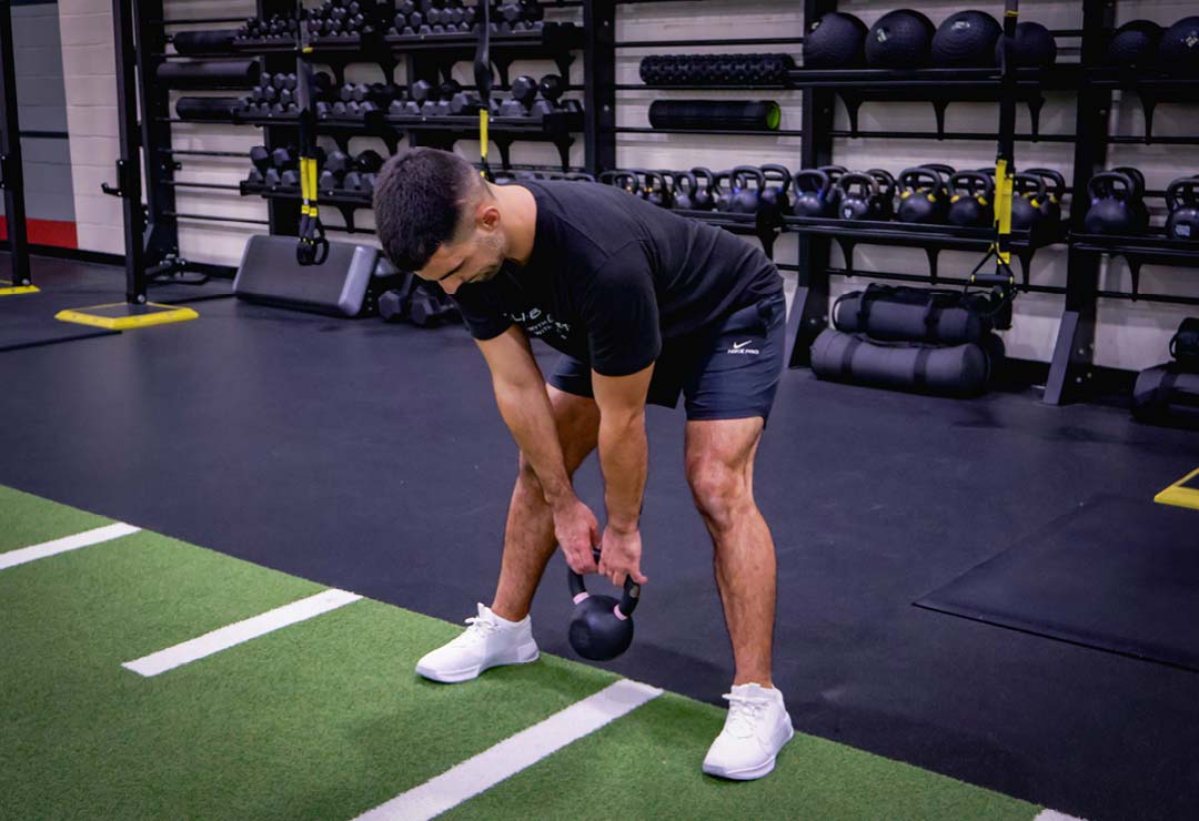 A member doing the High-Volume Glute Training with Time Under Tension workout of the month