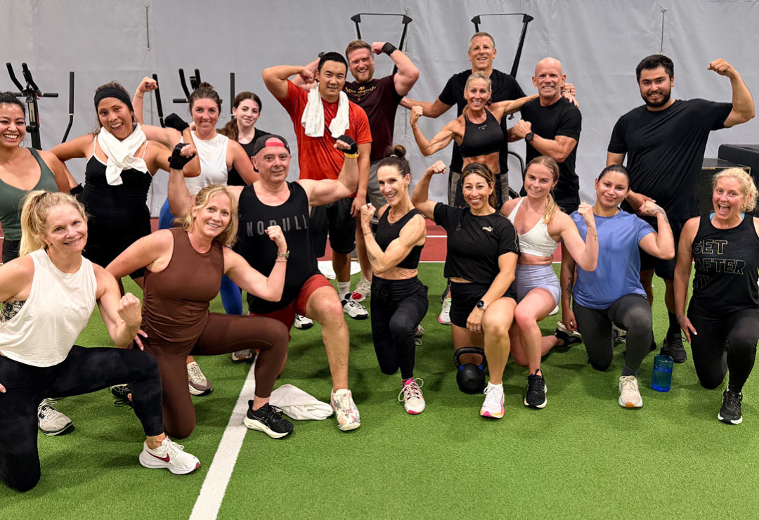 HYROX training in Aliso Viejo at ClubSport featuring sled pushes, rowing, and functional fitness exercises.